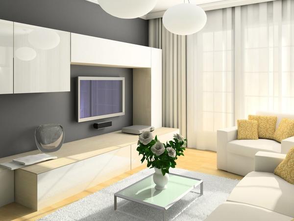 Для небольшой гостиной прекрасно подойдет красивая и компактная модульная стенка светлого цвета